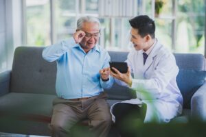 happy smile senior patient with doctor after checking at hospital