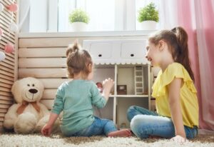 girls play with doll house