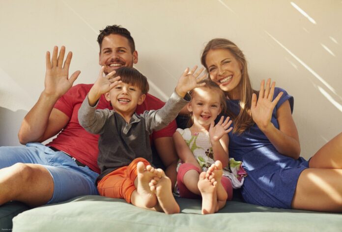 Couple with kids on patio having fun Couple with kids on patio having fun