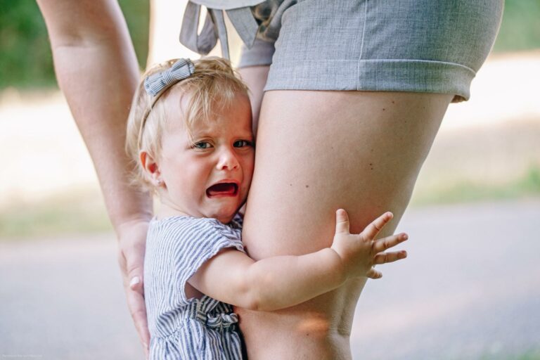 Mother comforting baby girl. Toddler tantrum bad behaviour. Mom pacifying child kid. Crying baby.